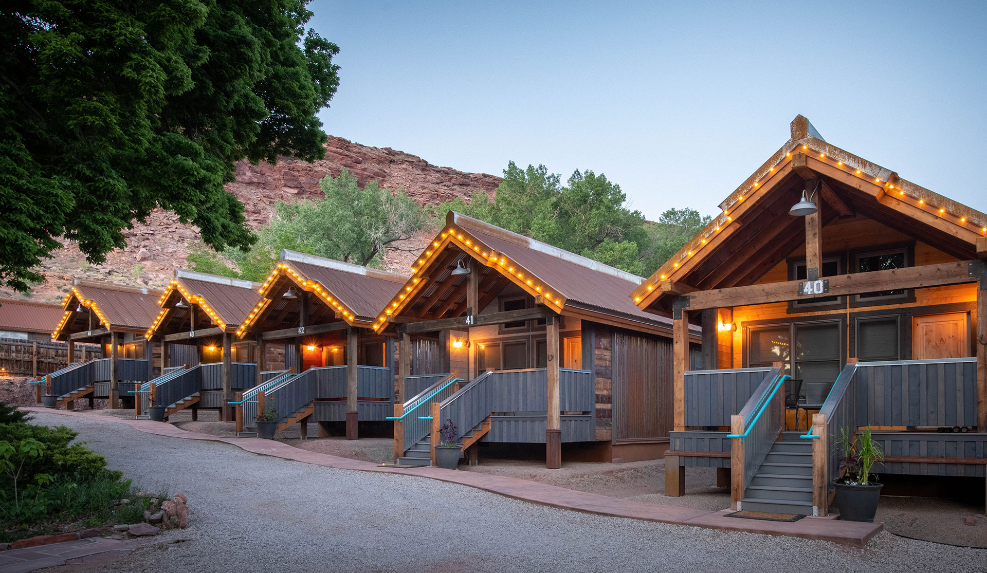 A large three dimensional model illustration of the front entrance of a guest bungalow unit at Moab Springs Ranch with a triangular wood slat roof.